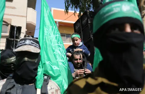 Palestinian supporters of Hamas movement take part in a protest against Trump's decision to recognize Jerusalem as the capital of Israel, at Nuseirat refugee camp, in the central of Gaza Strip on February 23, 2018. US Pr...