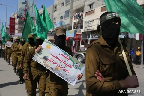 Palestinian supporters of Hamas movement take part in a protest against Trump's decision to recognize Jerusalem as the capital of Israel, at Nuseirat refugee camp, in the central of Gaza Strip on February 23, 2018. US Pr...