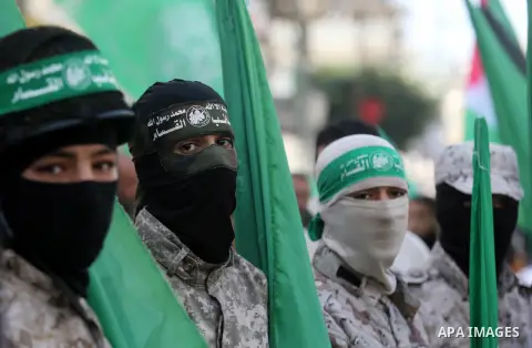 Palestinian supporters of Hamas movement take part in a protest against Trump's decision to recognize Jerusalem as the capital of Israel, at Nuseirat refugee camp, in the central of Gaza Strip on February 23, 2018. US Pr...
