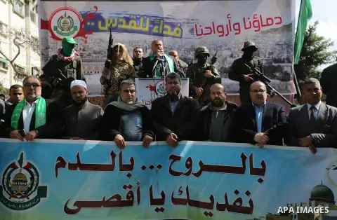 Palestinian supporters of Hamas movement take part in a protest against Trump's decision to recognize Jerusalem as the capital of Israel, at Nuseirat refugee camp, in the central of Gaza Strip on February 23, 2018. US Pr...