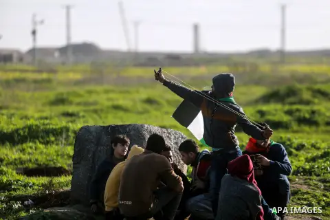 Palestinian protesters clash with Israeli security forces near the border fence with Israel, east of Gaza City on February 23, 2018. Photo by Mohammed Dahman