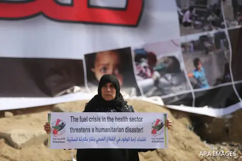 Palestinian women hold banners during a protest against the siege on the Gaza Strip in Gaza City on February 25, 2018. Israel has maintained a siege on Gaza for a decade which it says is necessary to limit Hamas, the Isl...