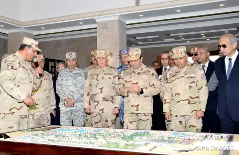 Egyptian President Abdel Fattah al-Sisi dressed in military uniform during his visit to the headquarters of the eastern forces of the Suez Canal at an unknown location in the Sinai on February 25, 2018. Photo by Egyptian...