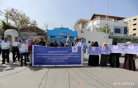 Palestinian journalists take part in a protest against Facebook decision to block Palestinian news sites' accounts, outside the UNESCO headquarters in Gaza City on March 5, 2018. Photo by Ashraf Amra