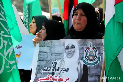 Palestinian women supporter Hamas movement take part in a rally on the occasion of International Women's Day, in Gaza city, on March 7, 2018. Photo by Mahmoud Ajour