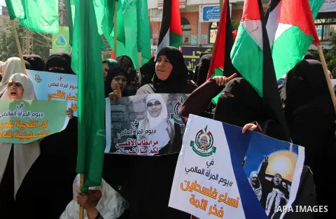 Palestinian women supporter Hamas movement take part in a rally on the occasion of International Women's Day, in Gaza city, on March 7, 2018. Photo by Mahmoud Ajour