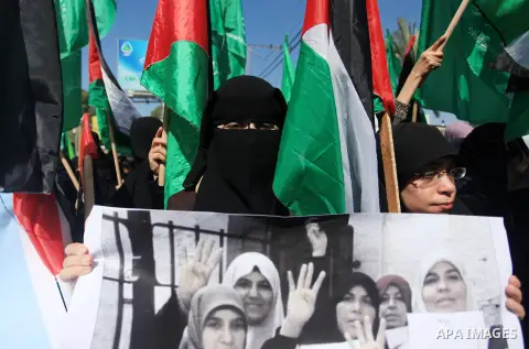 Palestinian women supporter Hamas movement take part in a rally on the occasion of International Women's Day, in Gaza city, on March 7, 2018. Photo by Mahmoud Ajour