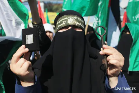 Palestinian women supporter Hamas movement take part in a rally on the occasion of International Women's Day, in Gaza city, on March 7, 2018. Photo by Mahmoud Ajour