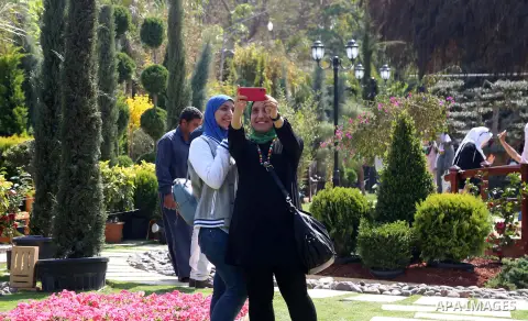 Egyptians visit the spring flower exhibition held at Orman Botanical Garden in Giza, Egypt, on March 10, 2018. Photo by Amr Sayed