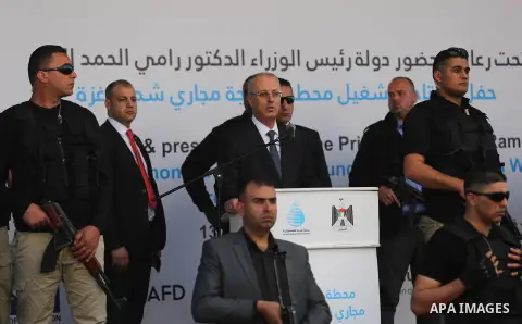 Palestinian Prime Minister Rami Hamdallah attends the inauguration ceremony of a waste treatment plant after an explosion targeted his convoy, in the northern Gaza Strip March 13, 2018. Photo by Ashraf Amra