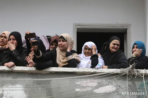 Relatives of Ismail Abu Riyala, a young Palestinian fisherman, mourn during his funeral in Gaza City on March 15, 2018, two weeks after he was killed in a disputed incident. Israel argued his boat had strayed outside Gaz...