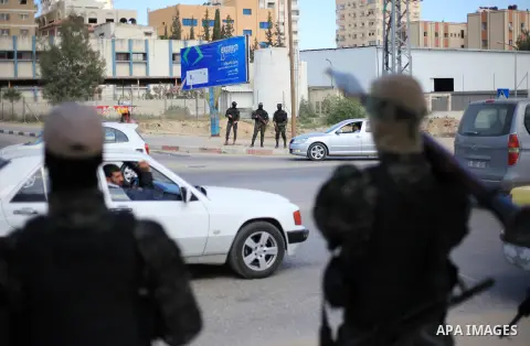 Members of Hamas' armed wing al-Qassam Brigades stand checkpoints during a military drill, in Gaza city on March 25, 2018. Photo by Mahmoud Ajour