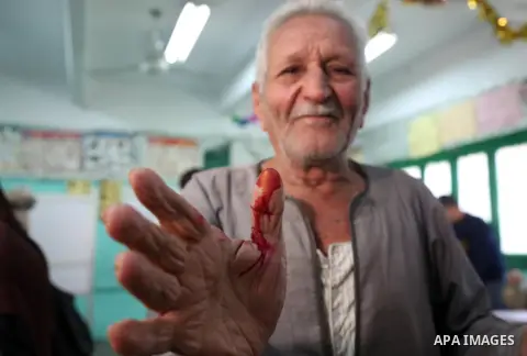 An Egyptian man shows his ink-stained finger after casting her vote at a polling station, in Cairo, Egypt, on March 26, 2018. Egyptians head to the polls in a three-day vote to choose between incumbent Abdel Fattah al-Si...
