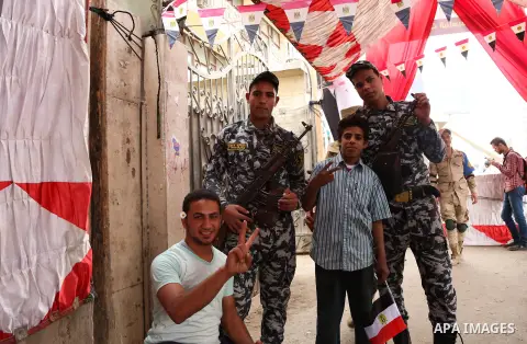 Egyptians celebrate on the third day of the presidential election at a polling station, in Cairo, Egypt, on March 28, 2018. Egyptians head to the polls in a three-day vote to choose between incumbent Abdel Fattah al-Sisi...