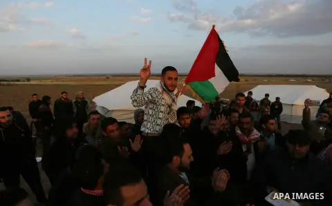 Paleatinians gather on the Gaza border with Israel, in the southern Gaza Strip, on March 29, 2018, ahead of a six-week protest camp. The exceptional protest is dubbed "The Great March of Return" and has the backing of th...