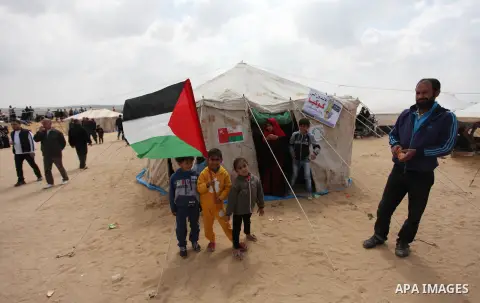 Palestinians take part in a tent city protest along the Israel border with Gaza, demanding the right to return to their homeland, east of Jabalia, in the northern of Gaza Strip on March 30, 2018. Photo by Mahmoud Ajour