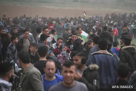 A wounded Palestinian is evacuated during clashes with Israeli security forces, during a tent city protest along the Israel border with Gaza, demanding the right to return to their homeland, east of Jabalia, in the north...