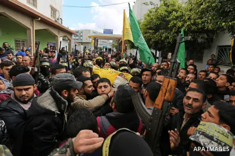 Palestinians carry the body of Hamdan Abu Amsha who was killed a day earlier during clashes with Israeli security forces in a tent city protest along the Israel border with Gaza, demanding the right to return to their ho...