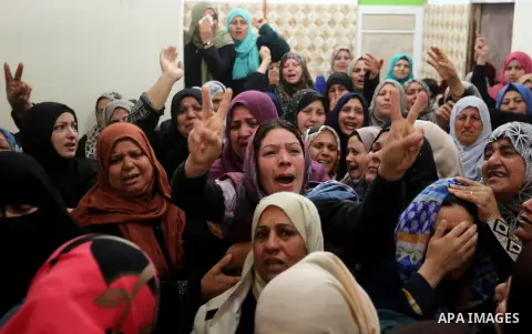 Relatives of Palestinian Hamdan Abu Amshah who was killed a day earlier during clashes with Israeli security forces in a tent city protest along the Israel border with Gaza, demanding the right to return to their homelan...