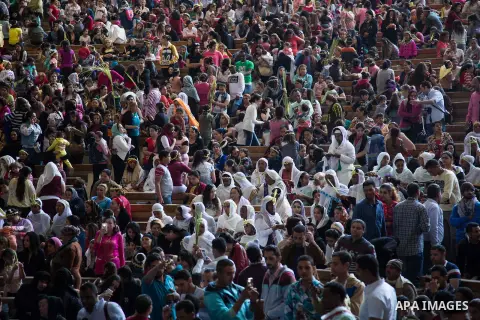 Egyptian Orthodox Christians take part in a mass marking the Palm Sunday at a church in Saint Samaan the tanner Monastery in Cairo on April 1, 2018. Photo by Stringer