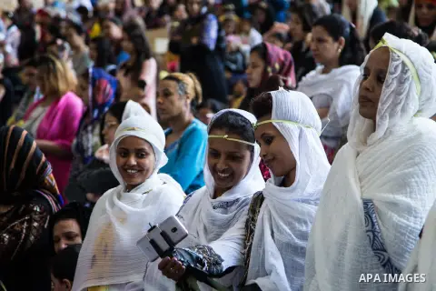 Egyptian Orthodox Christians take part in a mass marking the Palm Sunday at a church in Saint Samaan the tanner Monastery in Cairo on April 1, 2018. Photo by Stringer