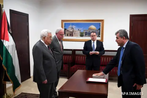 Mahmoud Aloni, sworn in as ambassador of the State of Palestine to Bolivia in front of Palestinian President Mahmoud Abbas, at his headquarters in the West bank city of Ramallah on April 9, 2018. Photo by Thaer Ganaim