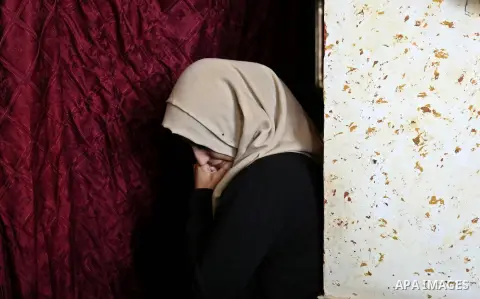 Female relatives of Islam Herzallah, 28, who was killed during clashes with Israeli security forces at the Israel-Gaza border, mourn during his funeral in Gaza City on April 14, 2018. Photo by Ashraf Amra