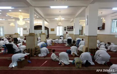 Samaritans pray at synagogue on top of Mount Gerizim near the northern West Bank city of Nablus to mark Rosh Hashanah holiday, eve the beginning of Hebrew months on April 15, 2018. Photo by Shadi Jarar'ah