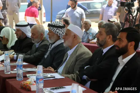 Members of the Palestinian legislative council from Hamas movement attend a protest to show solidarity with Palestinian prisoners held in Israeli jails, at the Israel-Gaza border in a tent city protest demanding the righ...