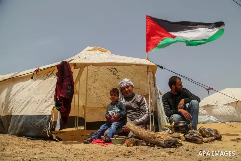 Palestinian protesters sit next to a tent during protest tents at the Israel-Gaza border where Palestinians demand the right to return to their homeland, in Jabalia in the northern Gaza Strip April 20, 2018. Photo by Ram...