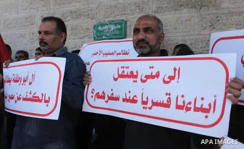 Relatives of Palestinian passengers who were disappeared during their traveling through the Rafah crossing take part during a protest to demand Egyptian authorities to detect their fate, in front of Red Cross office, in...