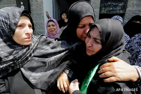 Palestinian women mourn during the funeral of Abdullah al-Shamali, 20, who was died of from his injuries, after he was shot by Israeli security forces during clashes last Friday, in Rafah in the southern Gaza Strip on Ap...