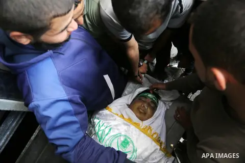 Palestinians mourn over the body of Palestinian Abdullah al-Shamali, 20, who was died of from his injuries, after he was shot by Israeli security forces during clashes last Friday, at a morgue in hospital in Rafah in the...