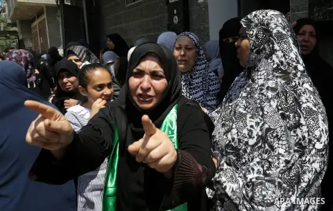 Palestinian women mourn during the funeral of Abdullah al-Shamali, 20, who was died of from his injuries, after he was shot by Israeli security forces during clashes last Friday, in Rafah in the southern Gaza Strip on Ap...