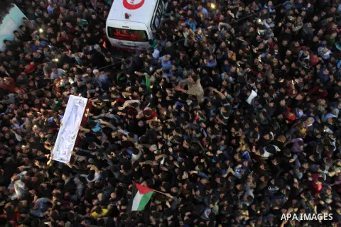 Palestinian mourners carry the body of Palestinian scientist Fadi al-Batsh, assassinated in Malaysia, during his funeral in the northern Gaza Strip, on April 26, 2018. after his body was returned to his homeland, a membe...