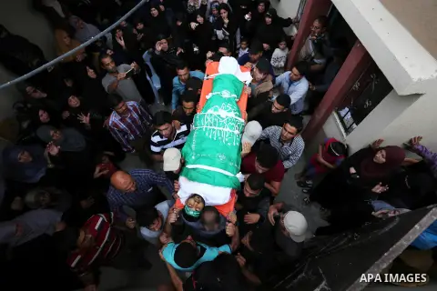 Mourners carry the body of Palestinian Mohammed Abu Reda, 20, who was killed by Israeli security forces at the Israel-Gaza border, during his funeral in Khan Younis in the southern Gaza Strip May 6, 2018. Israeli soldier...