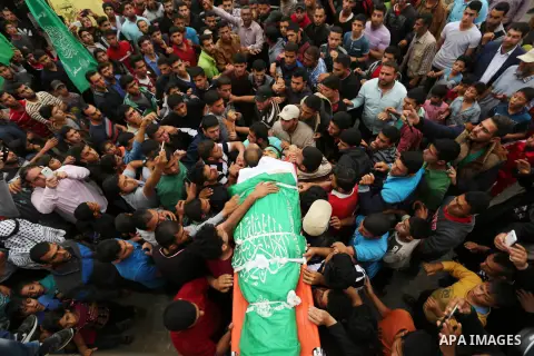 Mourners carry the body of Palestinian Mohammed Abu Reda, 20, who was killed by Israeli security forces at the Israel-Gaza border, during his funeral in Khan Younis in the southern Gaza Strip May 6, 2018. Israeli soldier...
