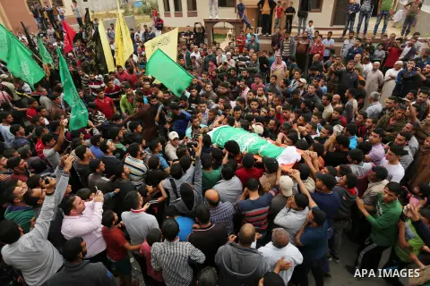 Mourners carry the body of Palestinian Mohammed Abu Reda, 20, who was killed by Israeli security forces at the Israel-Gaza border, during his funeral in Khan Younis in the southern Gaza Strip May 6, 2018. Israeli soldier...