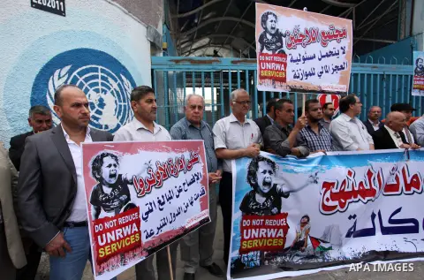 Palestinians take part in a protest against reducing the services provided to Palestine refugees in front of the UNRWA headquarters, in Gaza city, on May 8, 2018. Photo by Mahmoud Ajour