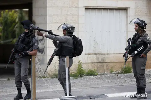 Israeli security forces take position during clashes with Palestinian protesters following a protest against U.S. embassy move to Jerusalem and on the occasion of the 70th anniversary of the "Nakba" in Bethlehem in the o...