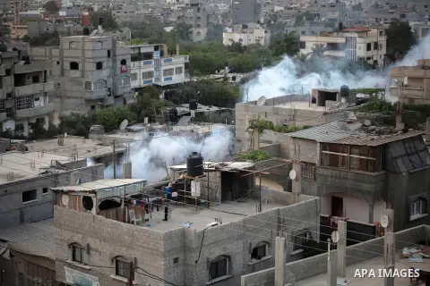 Palestinian municipal workers perform outdoor spatial spraying to prevent the spreading of the mosquito, in Beit Lahia in the northern of Gaza Strip on May 19, 2018. Photo by Ramez Habboub