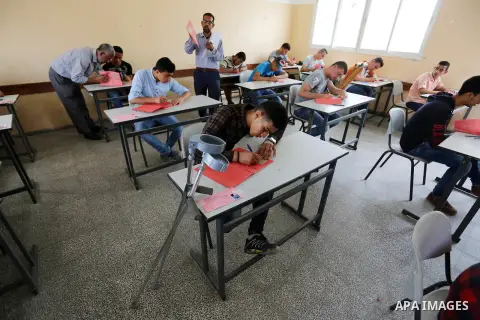 Palestinian Mohammed Musabeh, 17, a High school student, who amputated his leg after he was shot by Israeli troops during clashes in tents protest demanding the right to return to their homeland, at the Israel-Gaza borde...