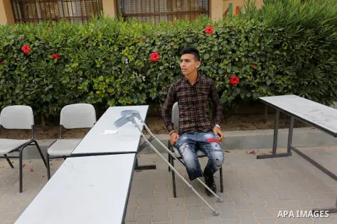 Palestinian Mohammed Musabeh, 17, a High school student, who amputated his leg after he was shot by Israeli troops during clashes in tents protest demanding the right to return to their homeland, at the Israel-Gaza borde...