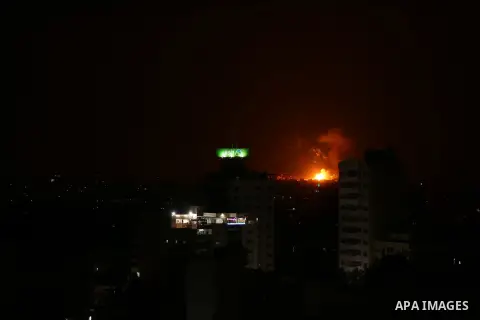 A picture taken from Gaza City on May 30, 2018, shows a fire and smoke billowing in the background following an Israeli air strike on the Palestinian enclave. The Israeli Defense Forces (IDF) said it launched more than 3...