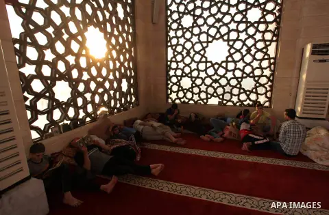 Palestinians take rest at a mosque in Gaza City during the Muslim holy month of Ramadan, on June 6, 2018. Ramadan is sacred to Muslims because it is during that month that tradition says the Koran was revealed to the Pro...