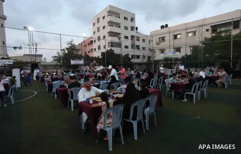 Palestinians break their fast on the Muslim holy fasting month of Ramadan in Gaza City, on June 6, 2018. Ramadan is sacred to Muslims because it is during that month that tradition says the Koran was revealed to the Prop...