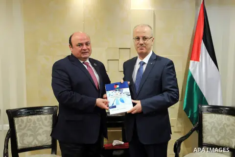 Palestinian Prime Minister, Rami Hamdallah, meets with the governor of the monetary authority Azzam Shawa, in the West Bank city of Ramallah, on June 11, 2018. Photo by Prime Minister Office