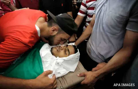 Relatives of Palestinian of Ahmed al-Assi, 21, who died of his wounds endured during clashes with Israeli troops in a tent city protest where Palestinians demand the right to return to their homeland at the Israel-Gaza b...