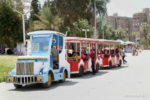 Egyptians enjoy their time on the third day of Eid al-Fitr holiday which marks the end of the Muslim holy month of Ramadan at a zoo in Cairo, Egypt, on June 17, 2018. Photo by Amr Sayed