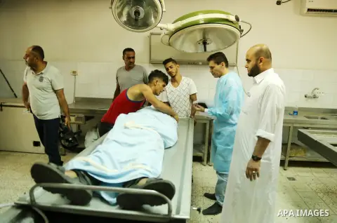 The brother of Sabri Abu Khadir 24, mourns over his body at the morgue of Al-Shifa Hospital in Gaza City on June 18, 2018. A Palestinian was killed by Israeli fire near the Gaza Strip's border with Israel, the health min...
